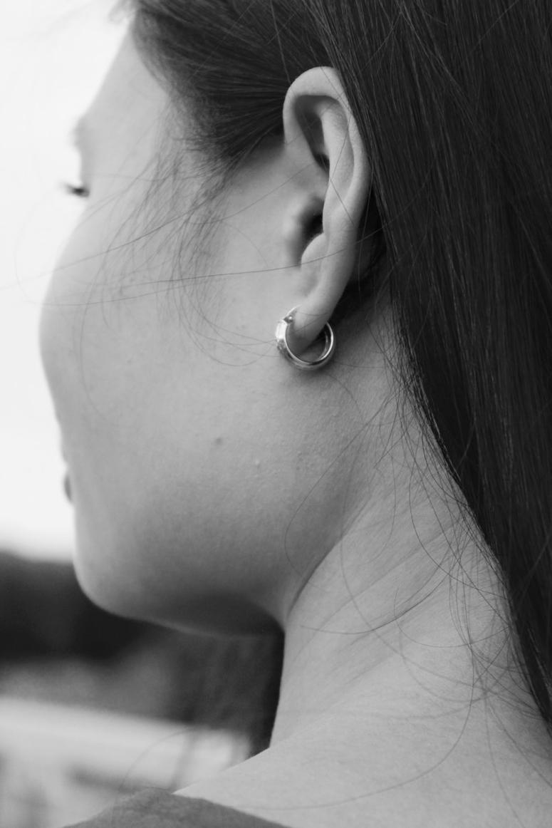 a woman wearing an earring