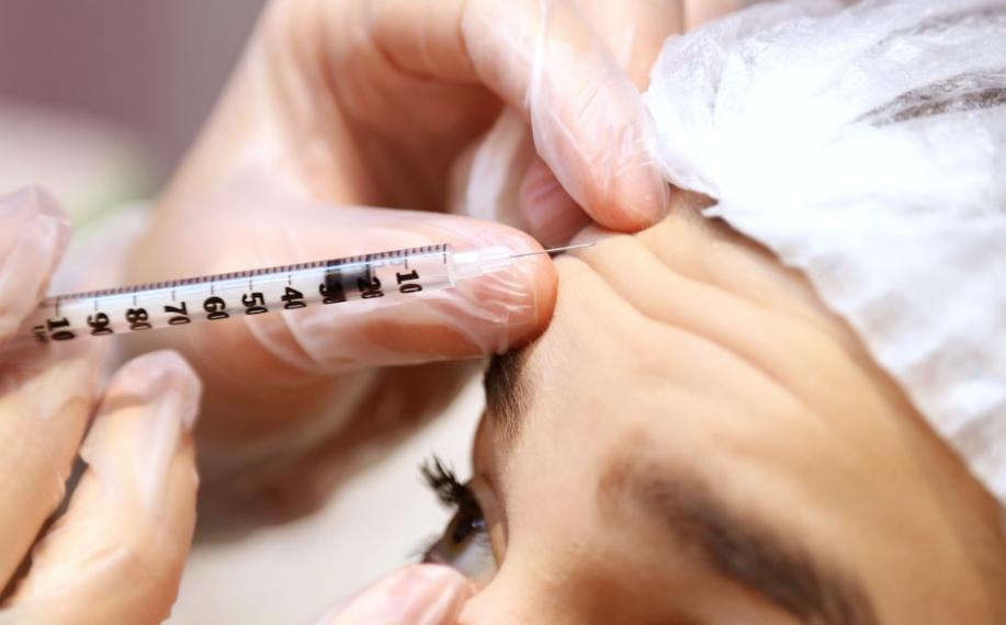 Botox being injected into forehead
