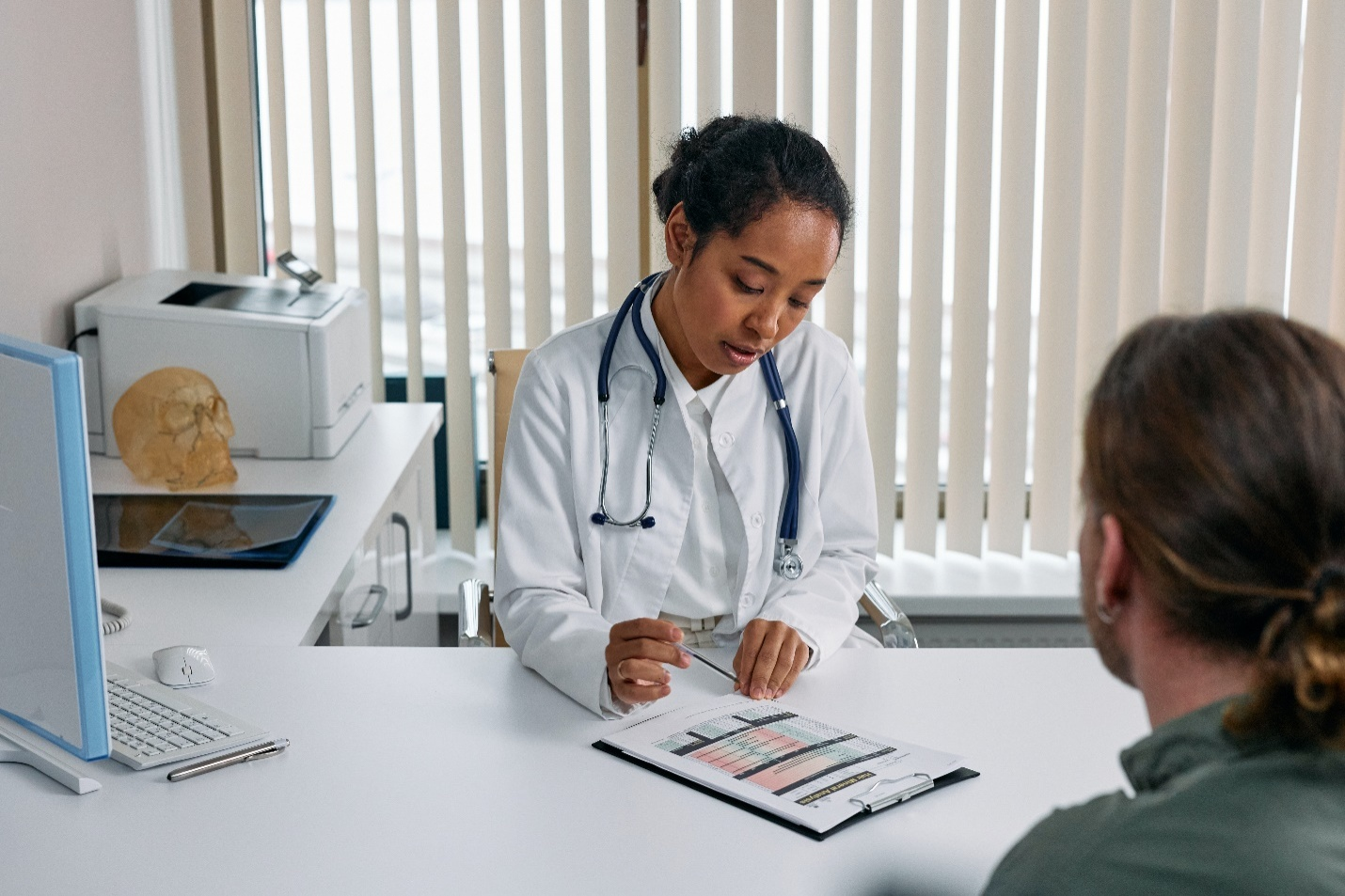 A doctor discussing a report with her patient