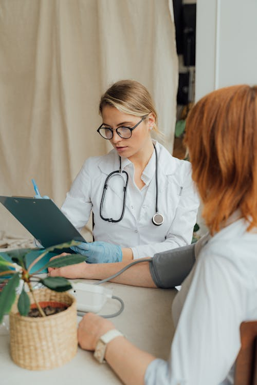 Woman consulting doctor