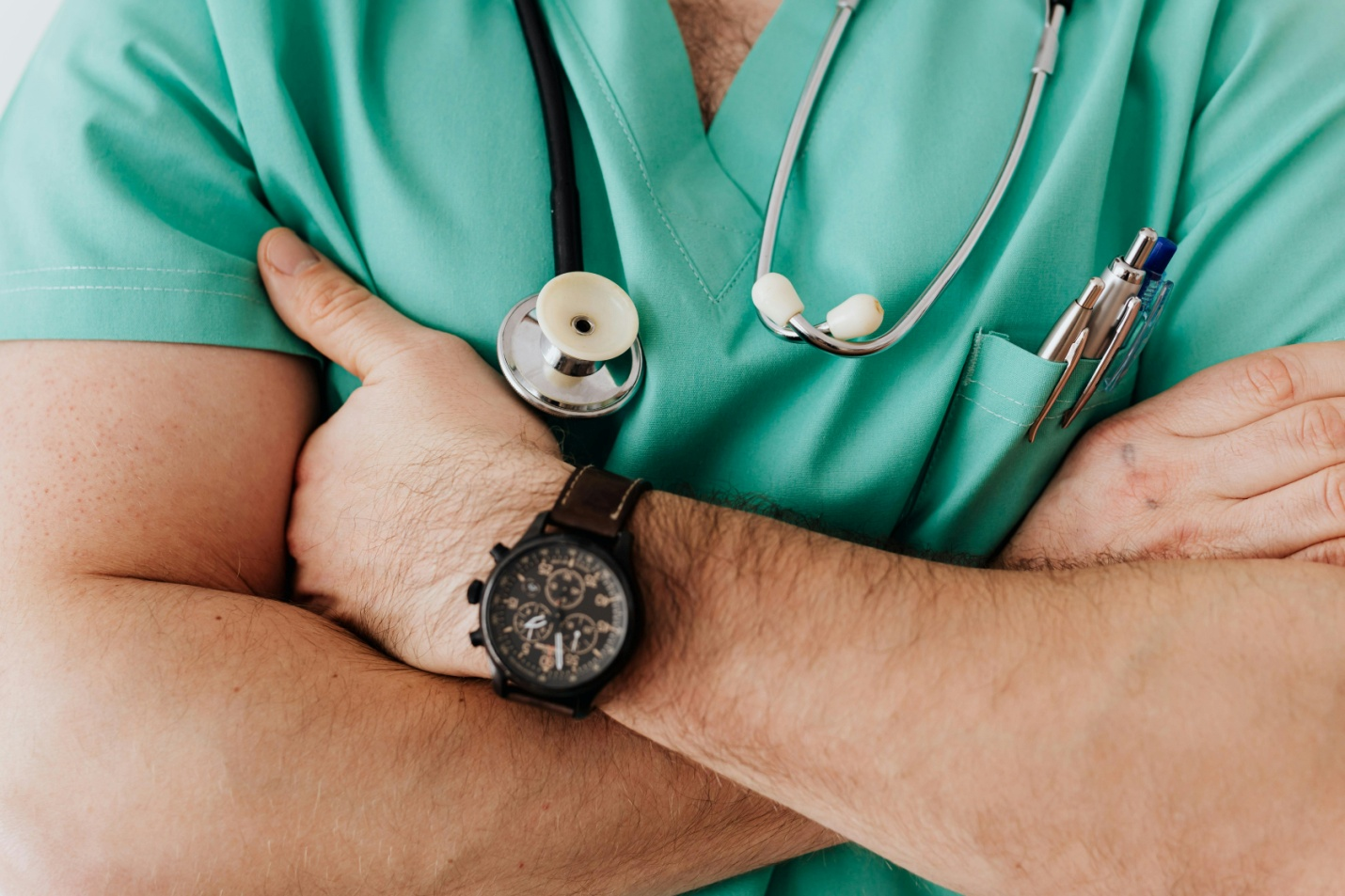 A person getting their blood pressure checked by a healthcare worker