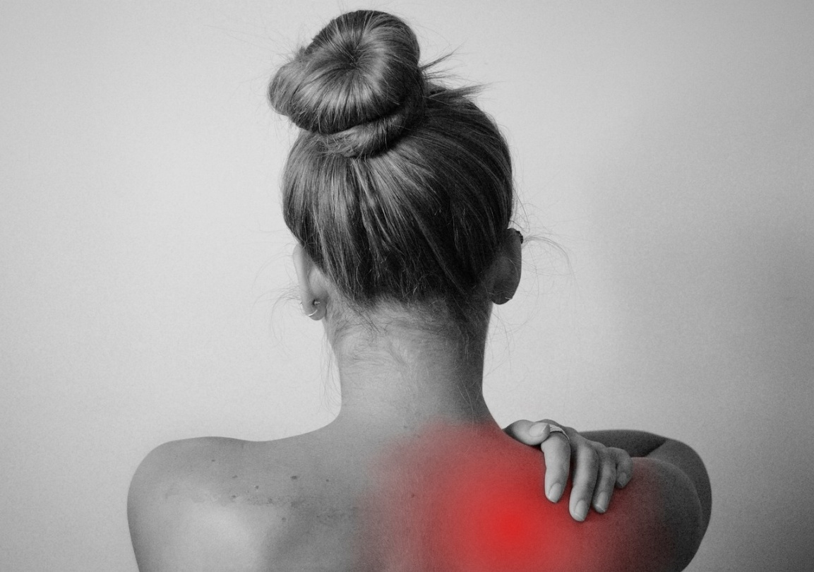 A person experiencing pain caused by fibromyalgia