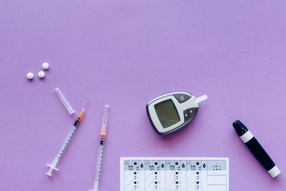 Glucometer on a lilac background