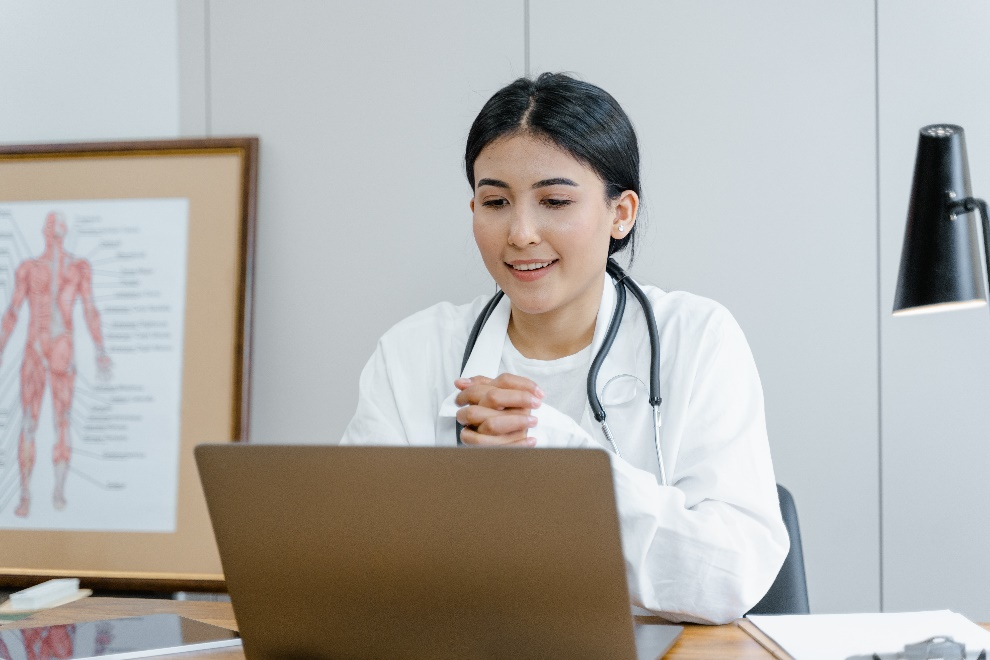 A young doctor and a laptop