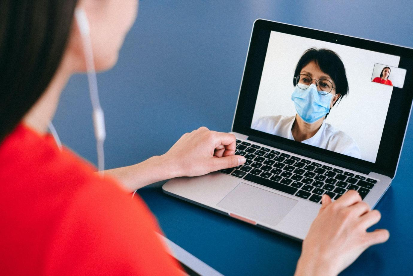 Girl consulting an online doctor for strep throat
