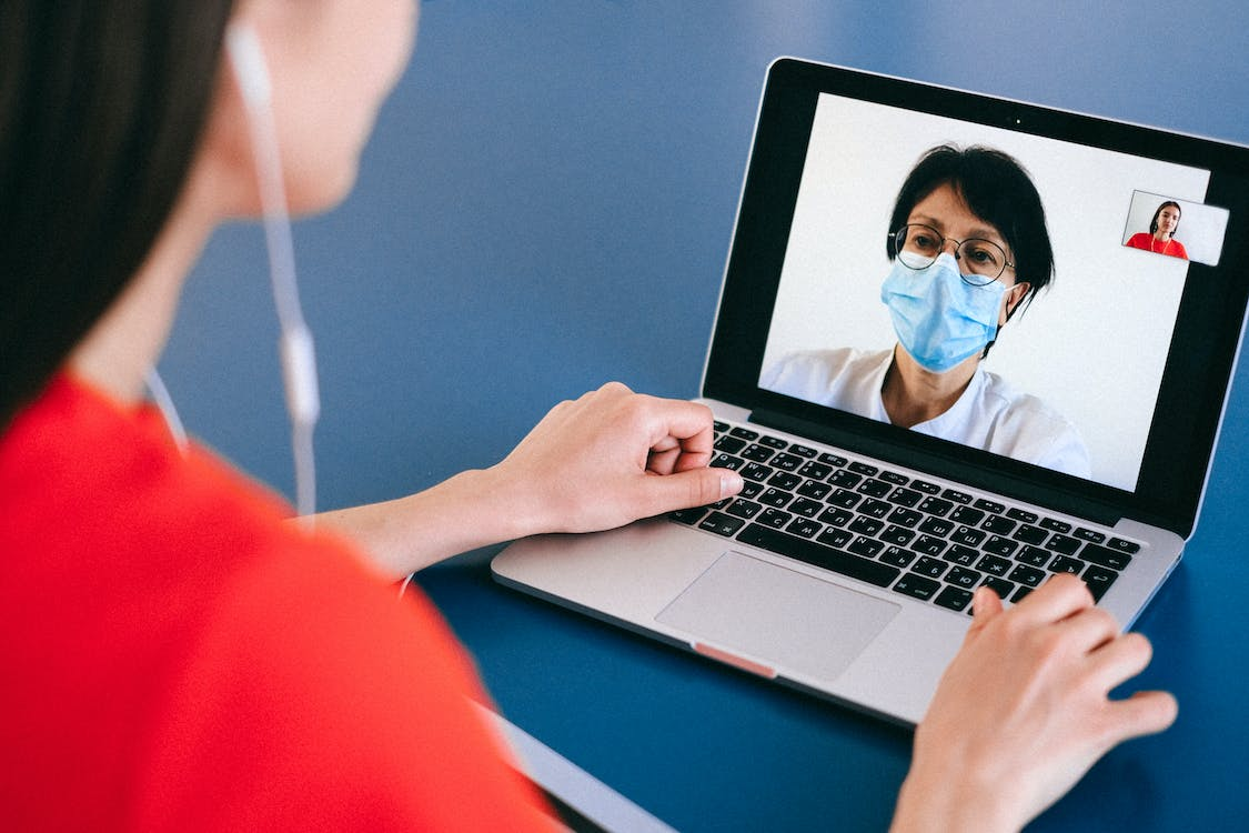 person talking to a doctor on a video call