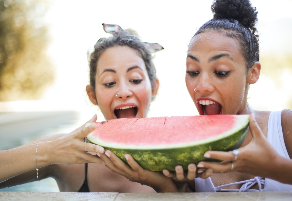Women eating watermelon