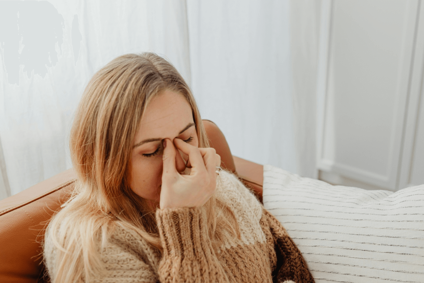 A woman experiencing a headache 