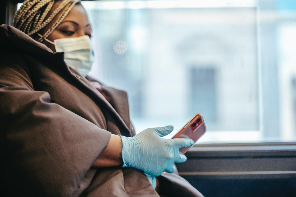 Woman wearing surgical gloves and a face mask