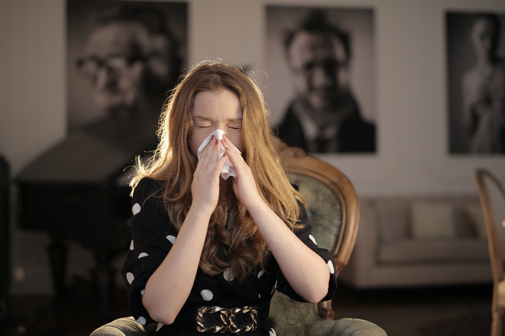 Woman with a tissue on her nose