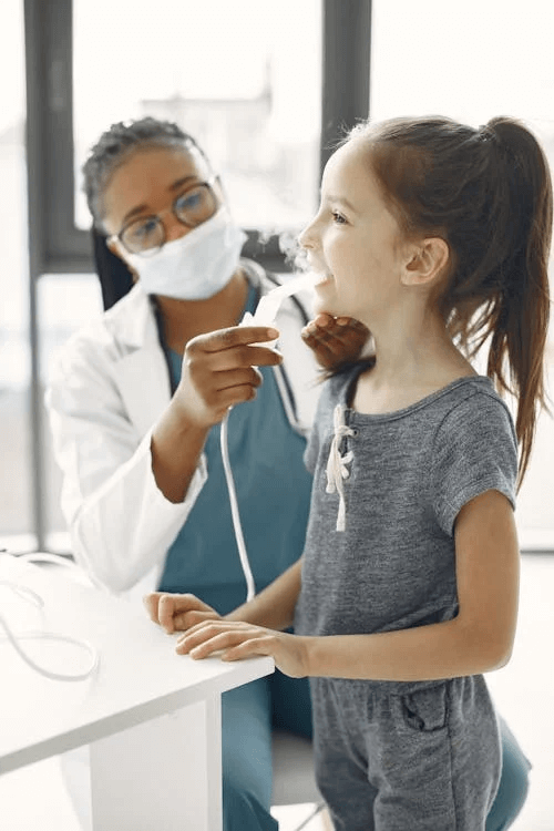 Asthma medication being administered to a young patient