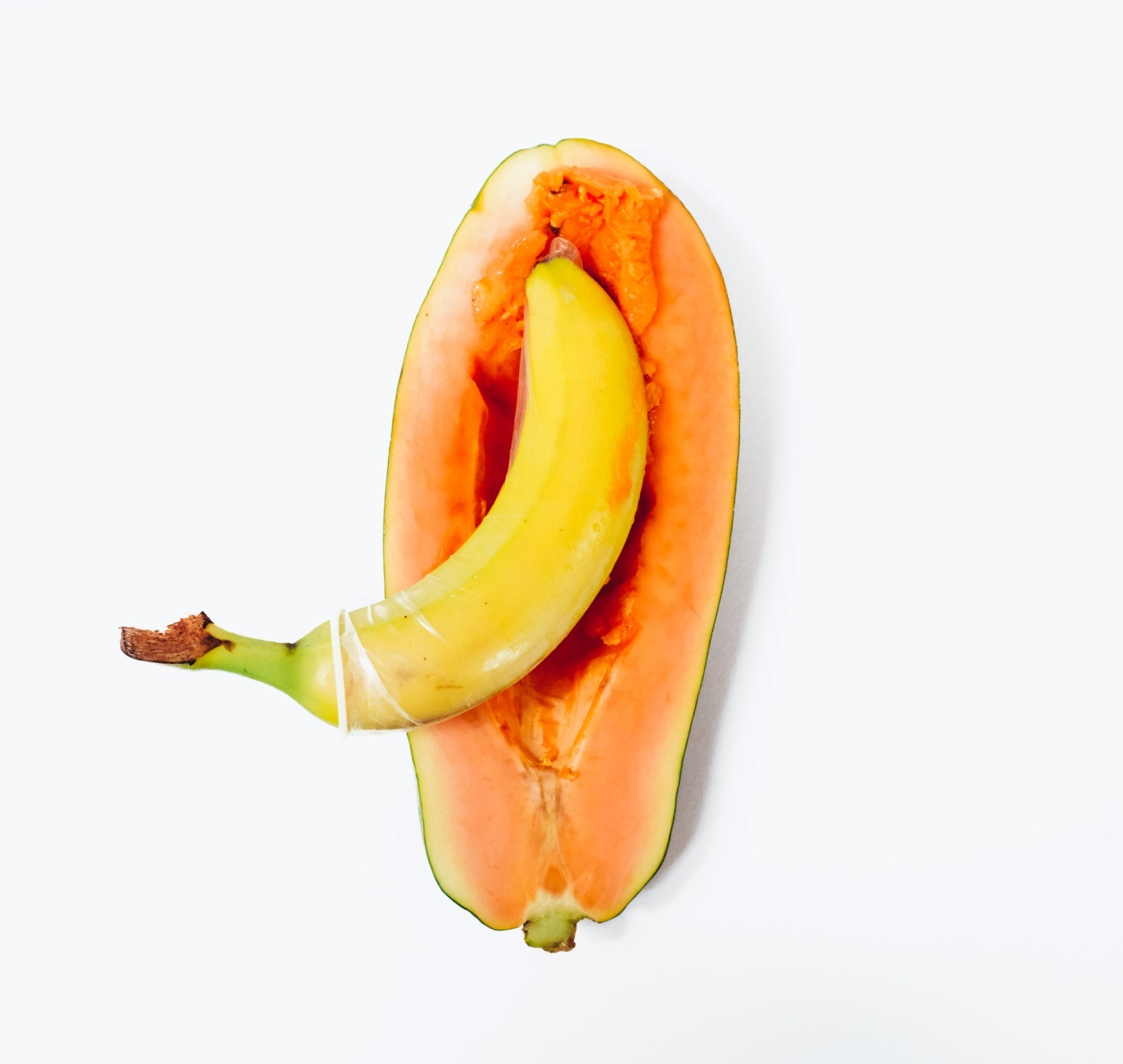A banana inserted inside a papaya