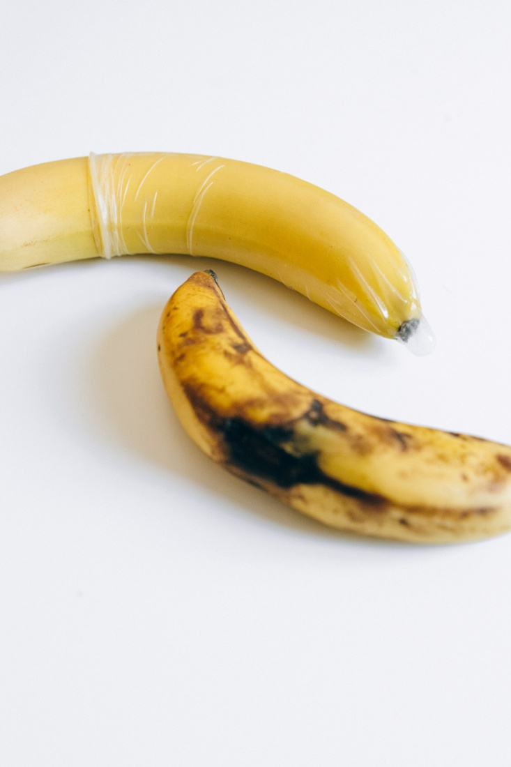 A rotten banana on a white surface