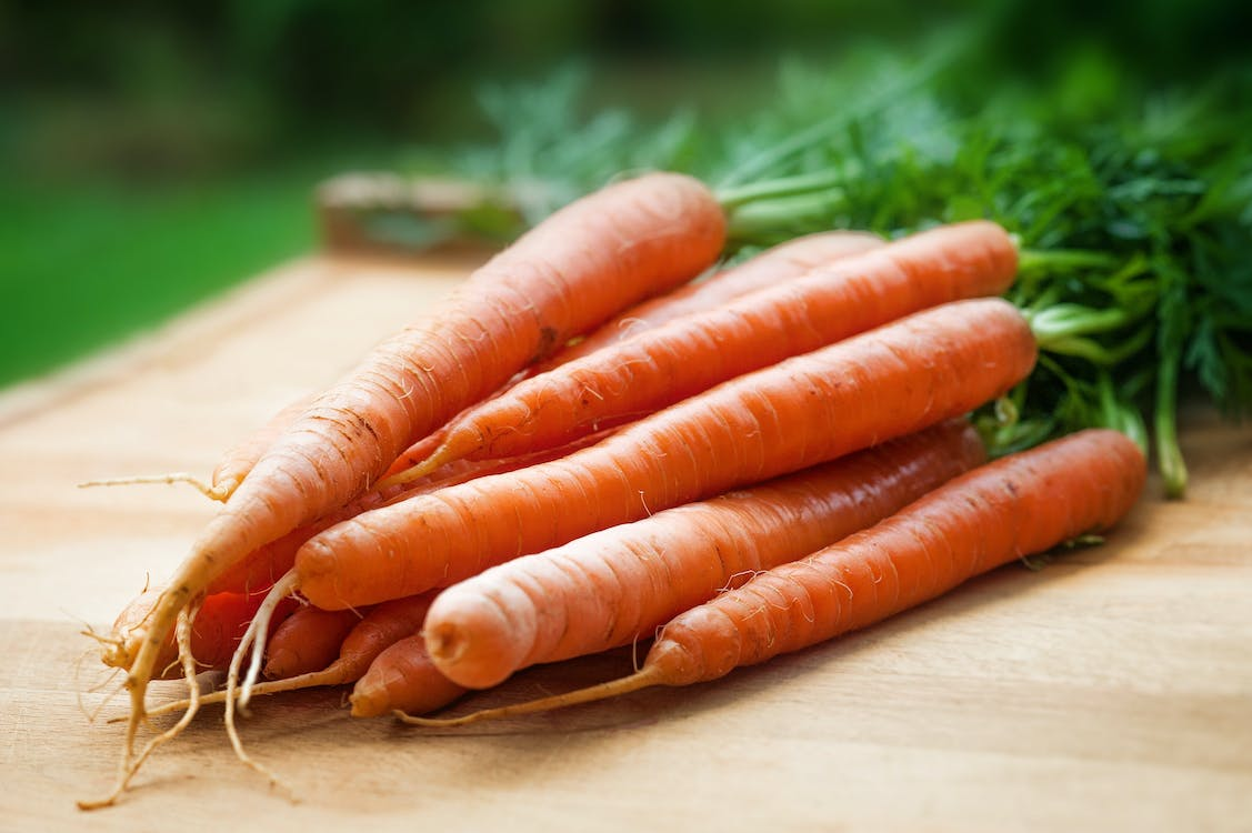 A bunch of carrots on a table