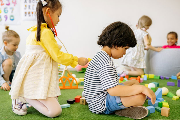 children playing with toys in a room