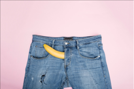 a denim pant and a banana depicting an erection
