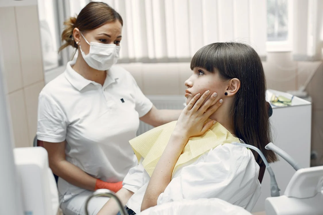 an image of a dentist and patient