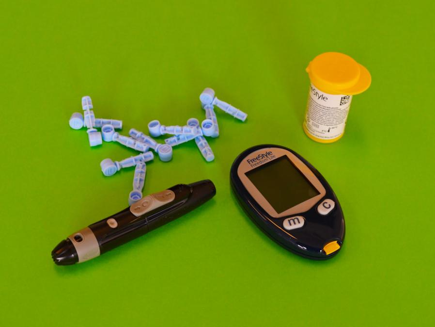 A photo of a diabetes management device and medicine