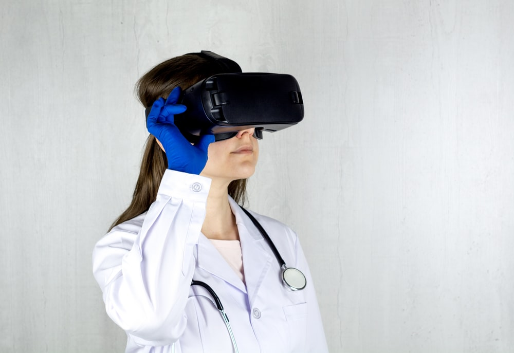 A doctor wearing VR goggles