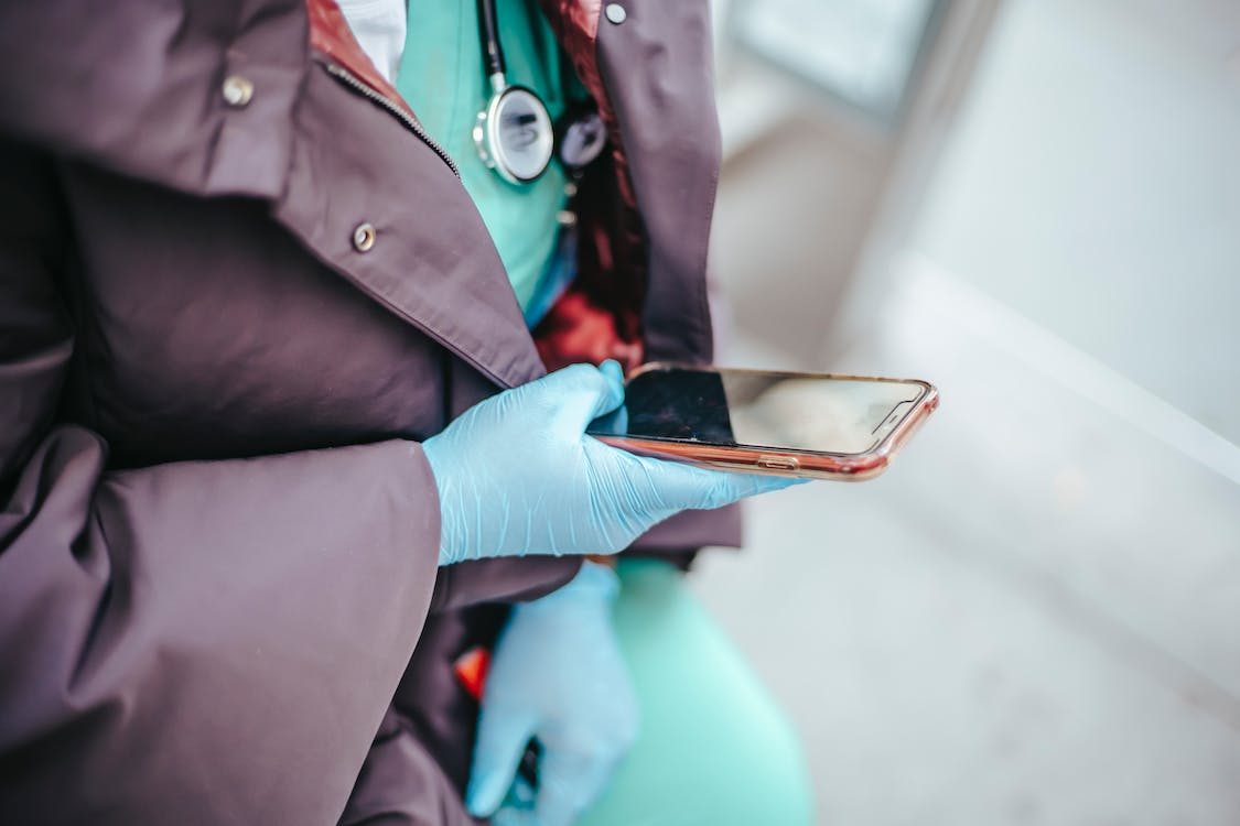 A doctor using a phone