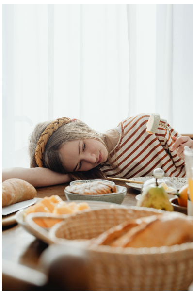 girl looking at food sadly