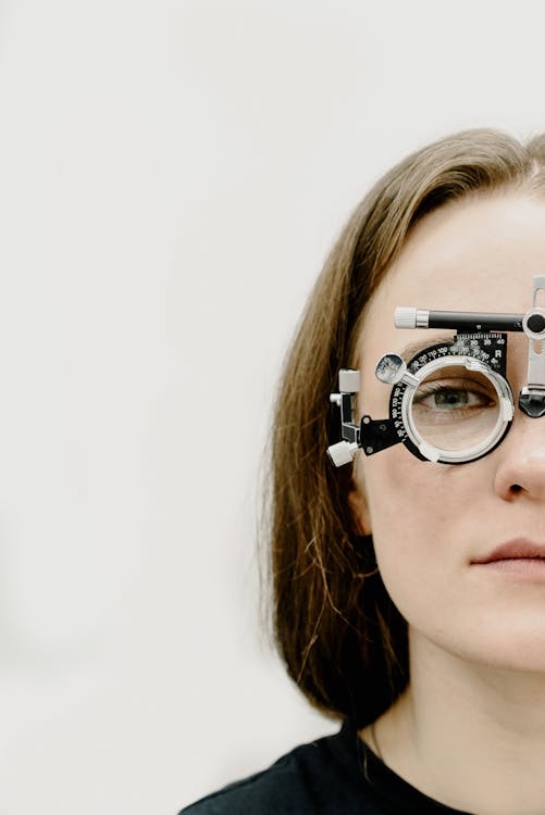 Woman in the rim with a trial lens in ophthalmology clinic