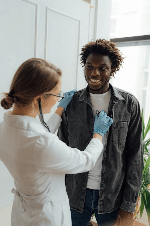 Doctor checking a patient’s heart health with a stethoscope