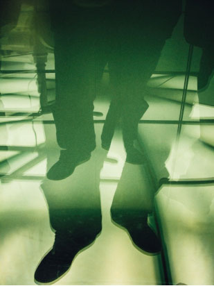 man’s legs shown standing on floor depicting dizziness