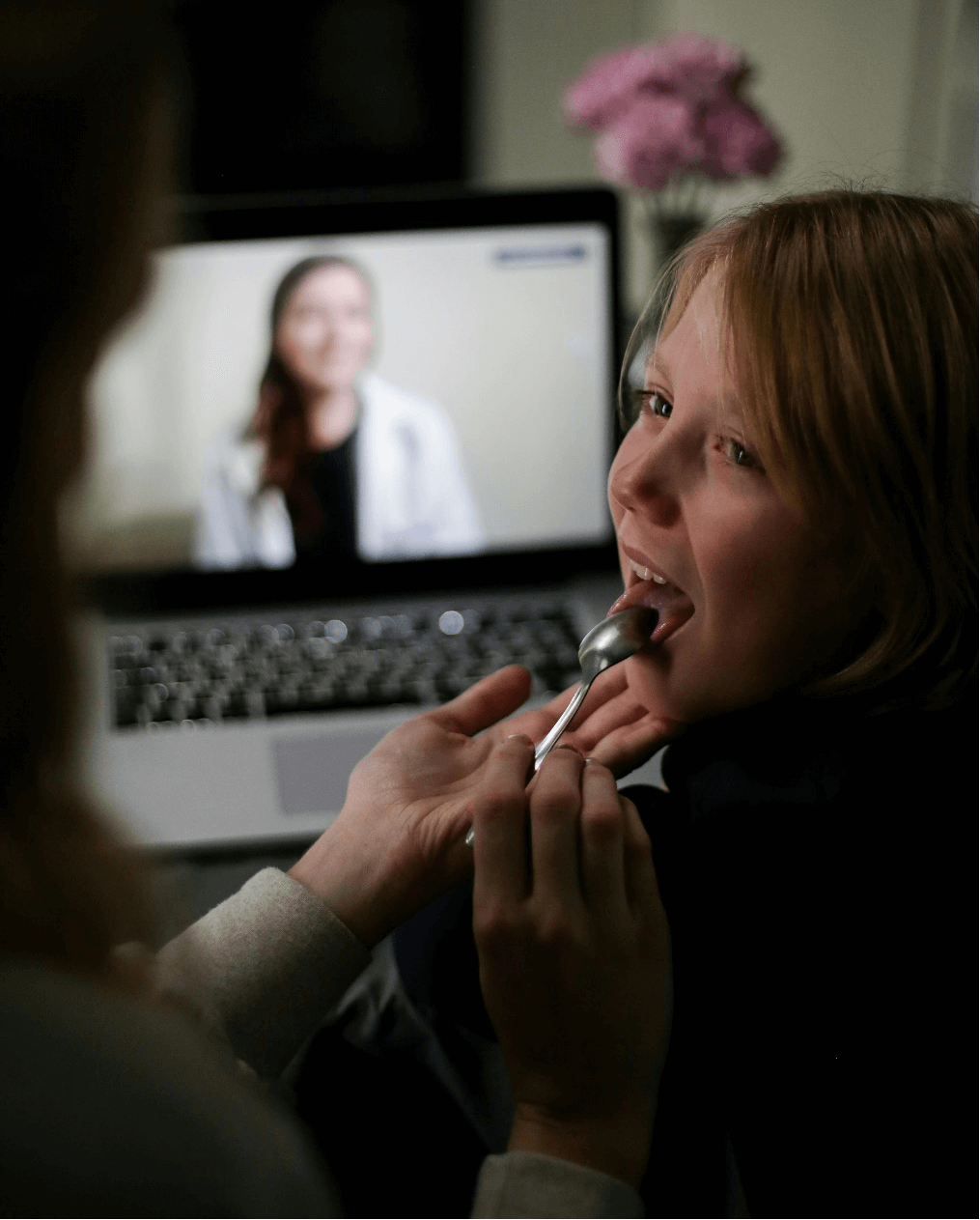 a mother checking her child’s mouth