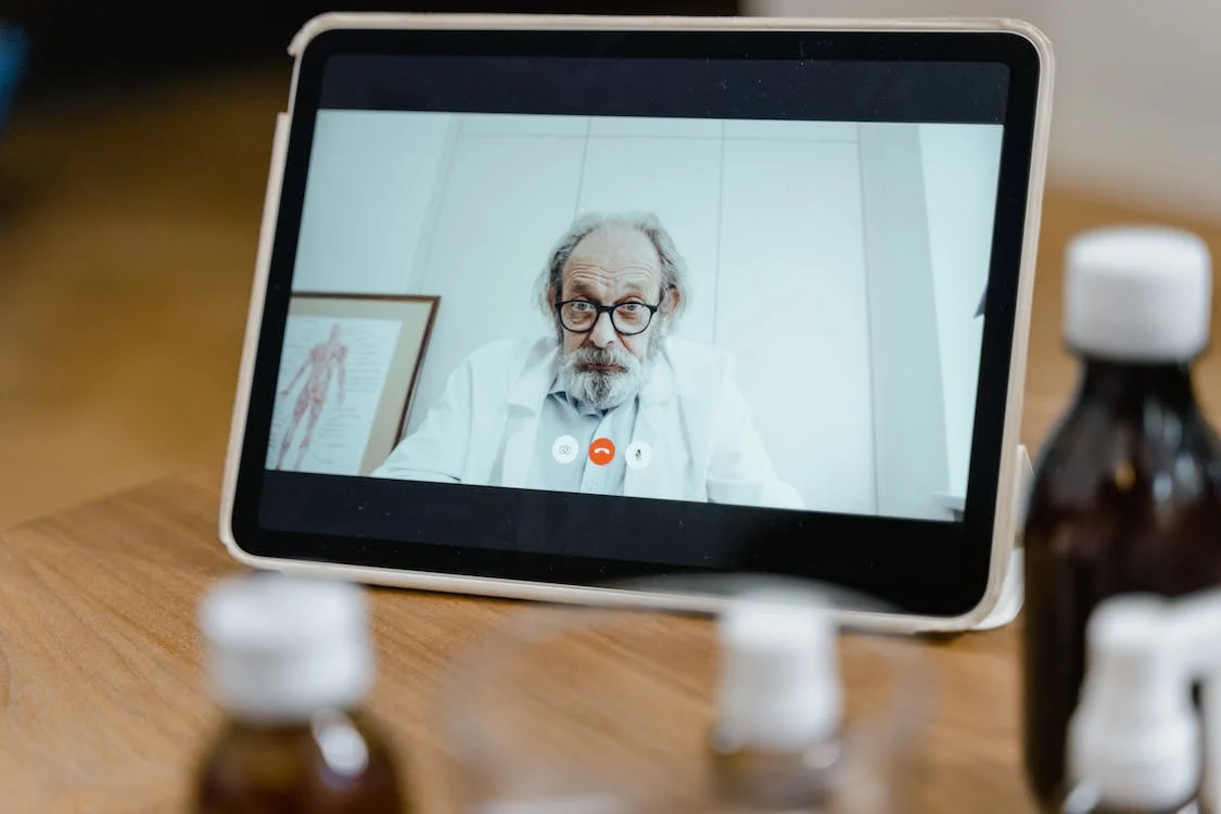 An online medical consultation by a virtual doctor on a tablet computer 