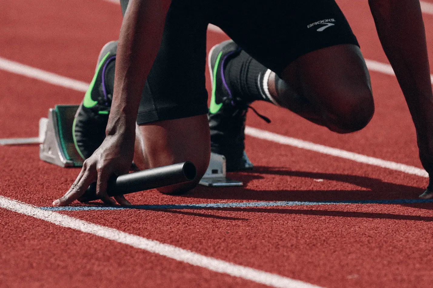 An athlete getting ready to sprint 