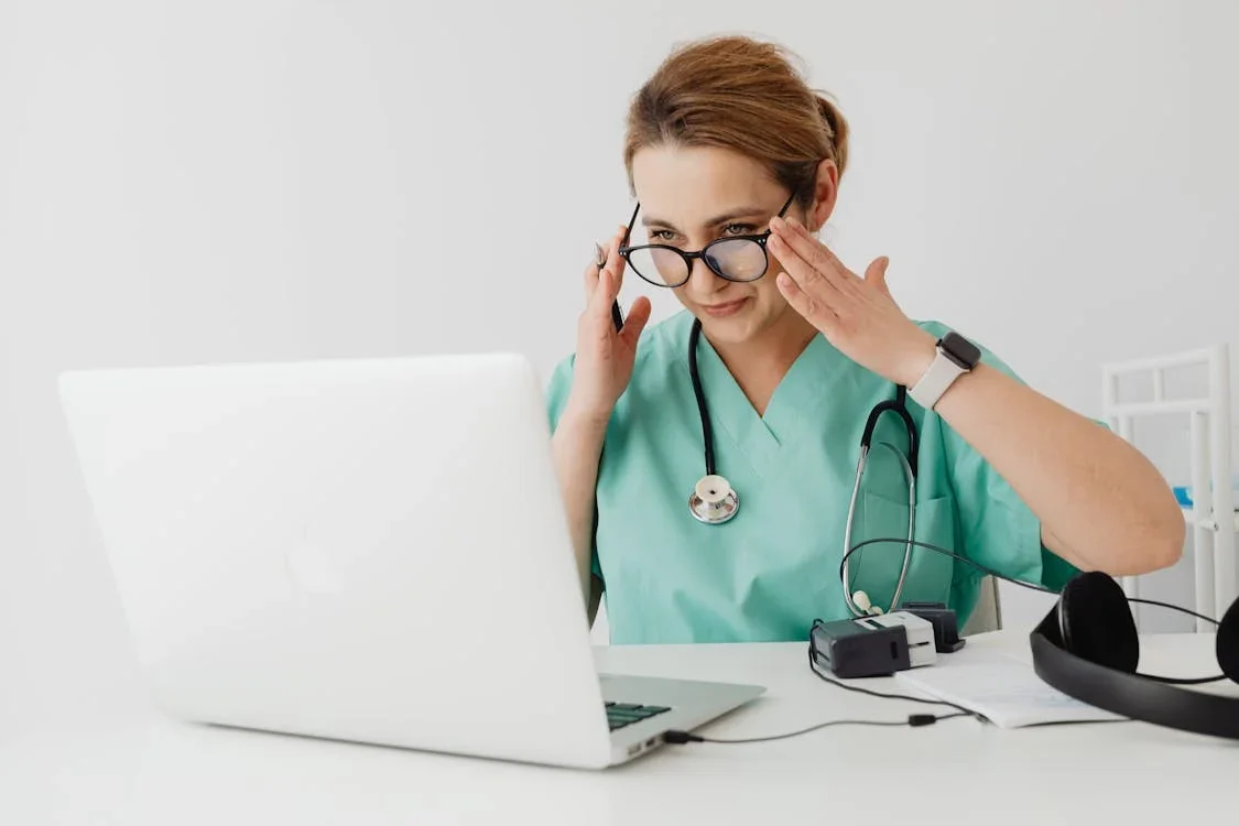 A doctor using a laptop