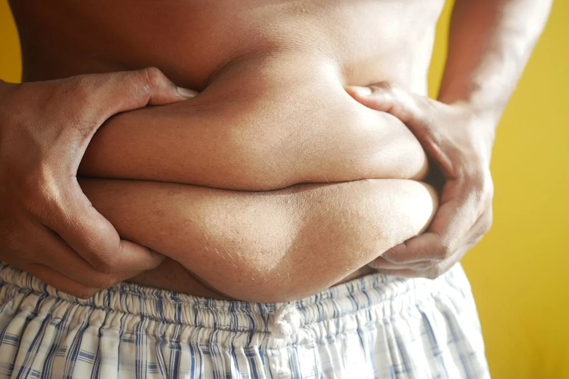 Person holding their stomach