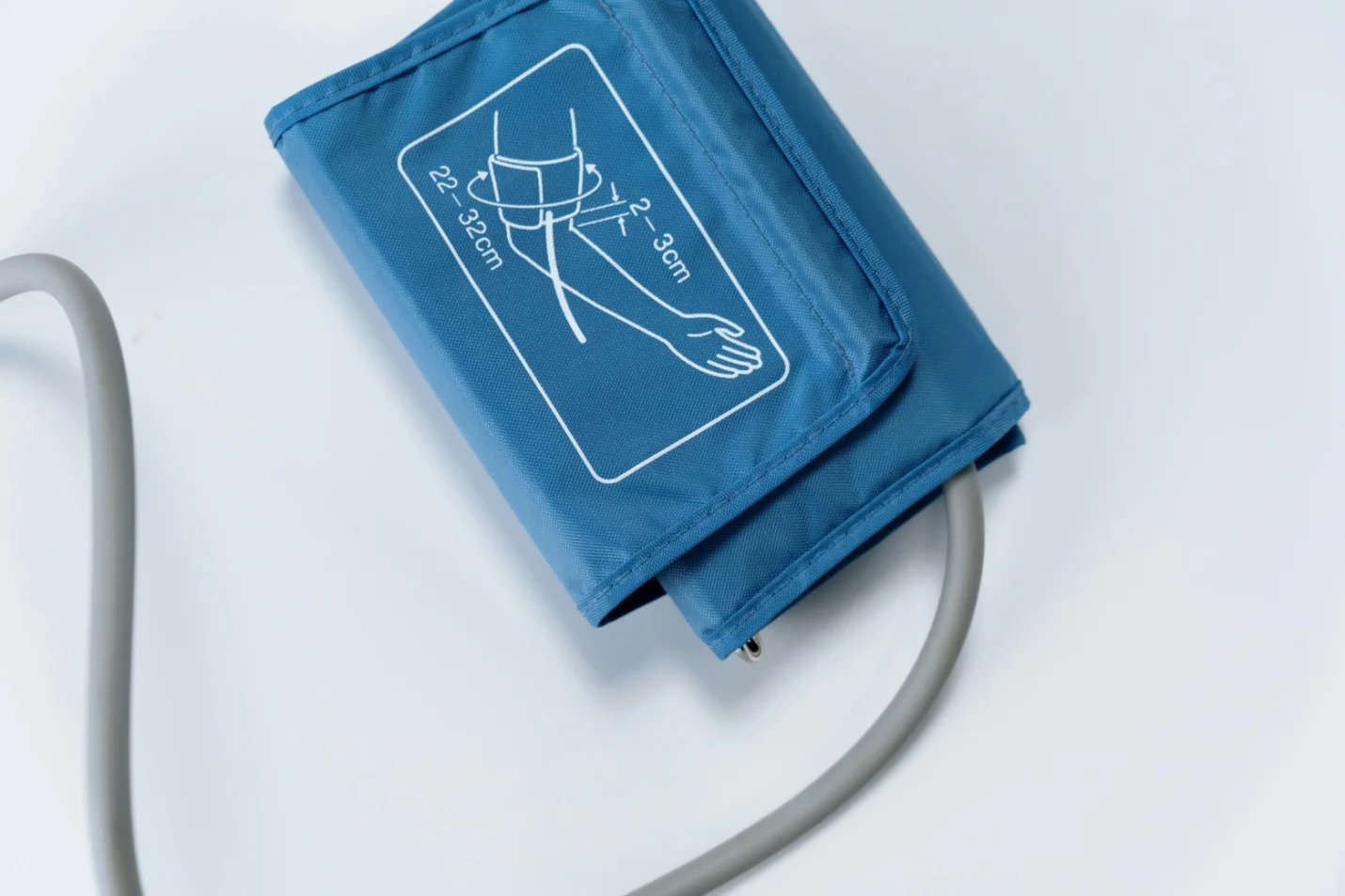 A sphygmomanometer on a white surface