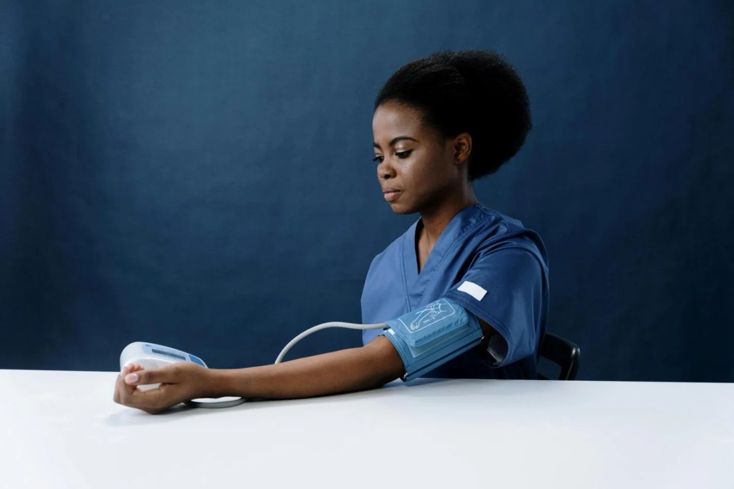 A Healthcare Worker Measuring her Blood Pressure