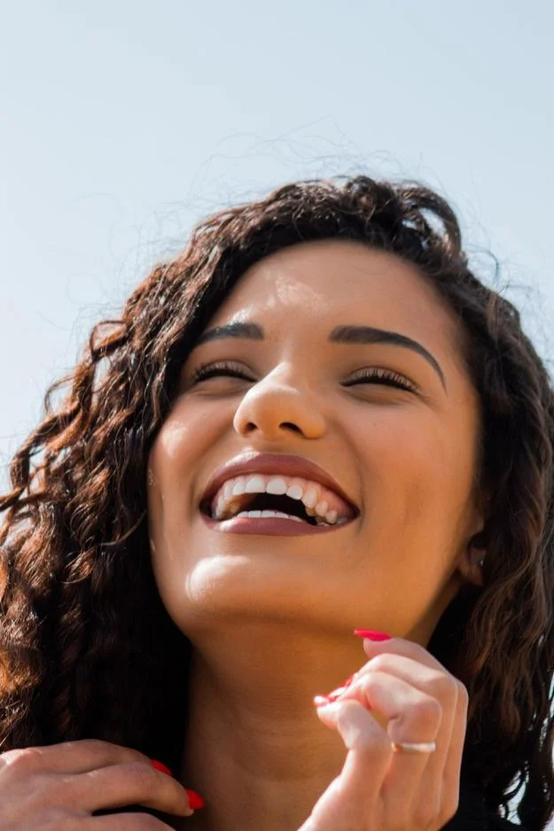 An image of a woman smiling 