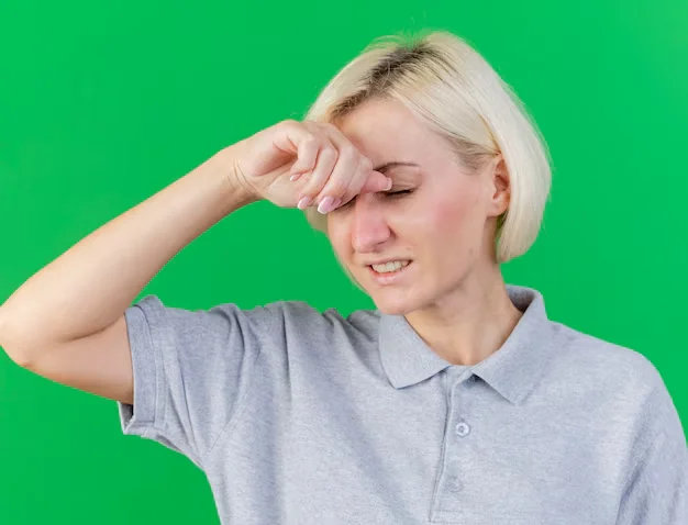 Girl rubbing her itchy eye due to pink eye.