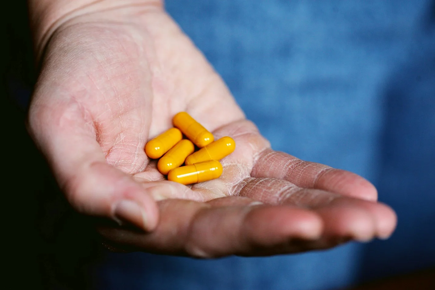 pills in a person’s hand