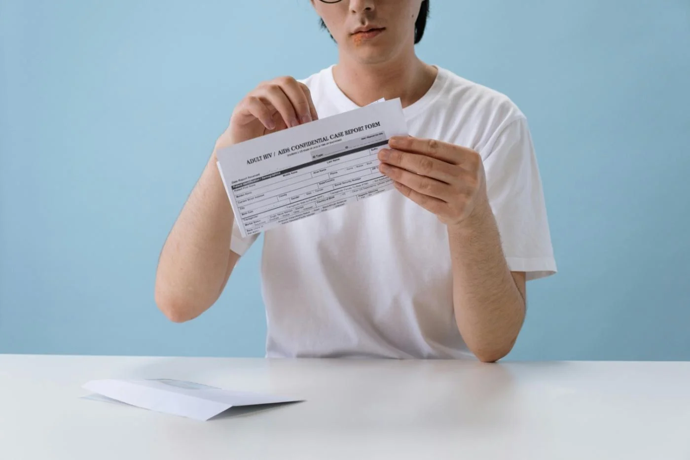 A Man Opening HIV Report Form