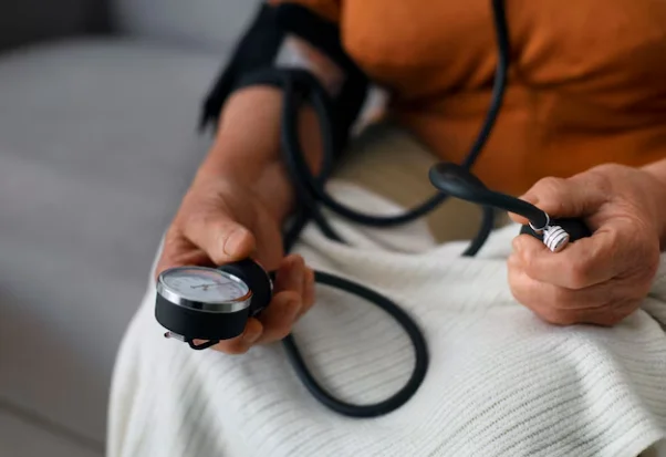 Person checking their blood pressure.