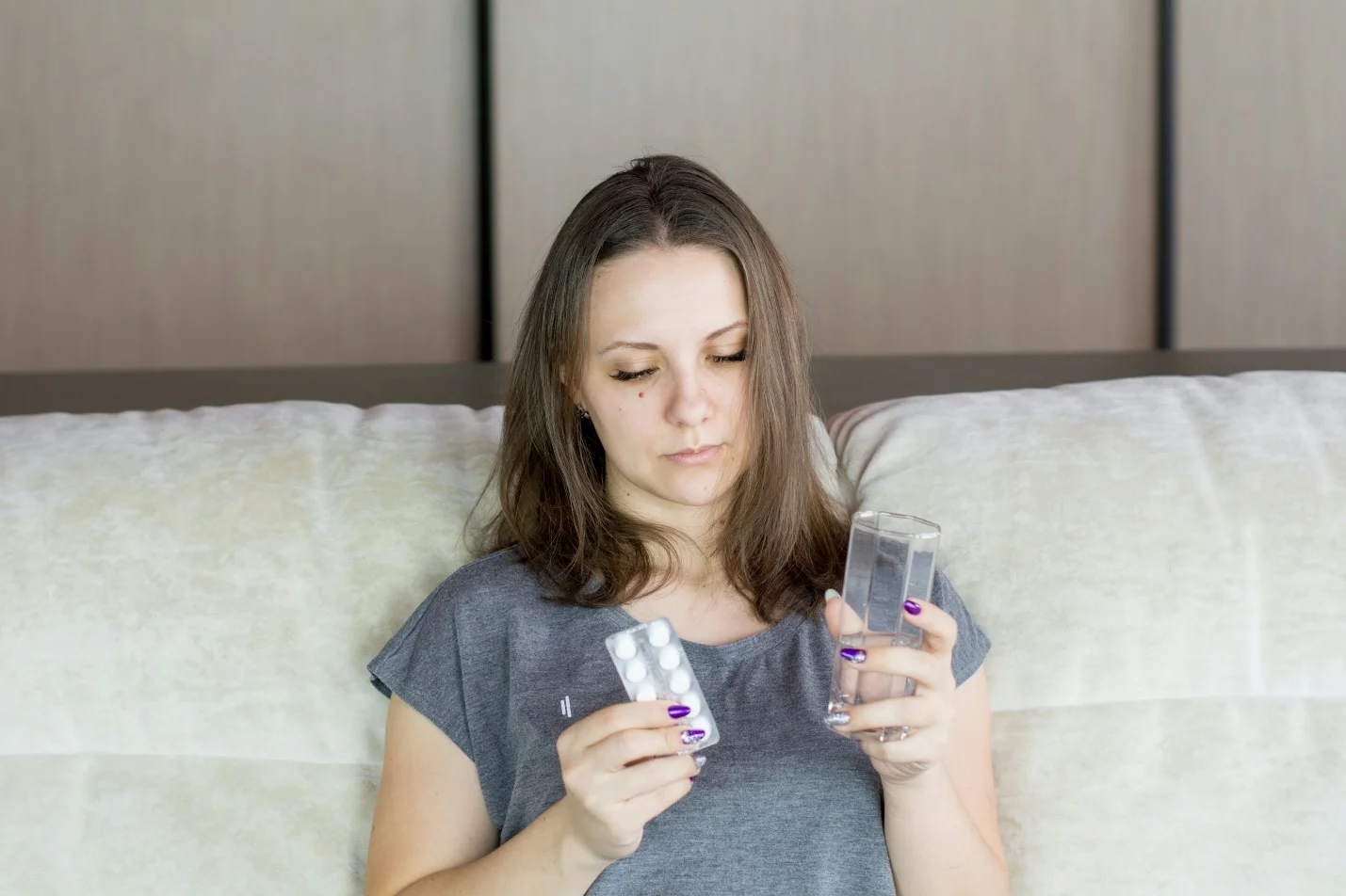 a person taking her medication 