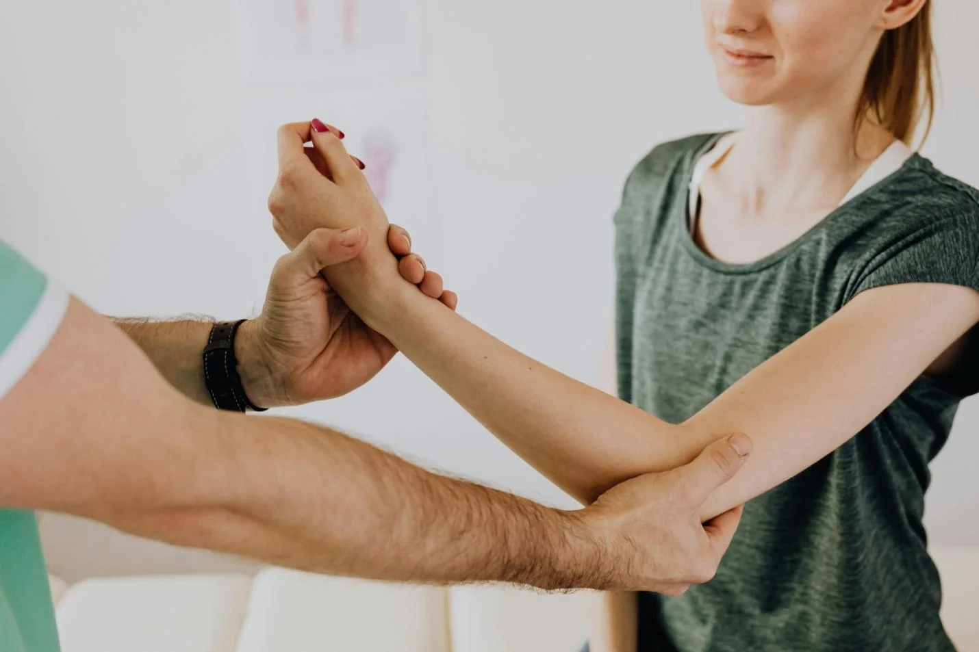  A Woman's Arm Being Examined by a Healthcare Professional