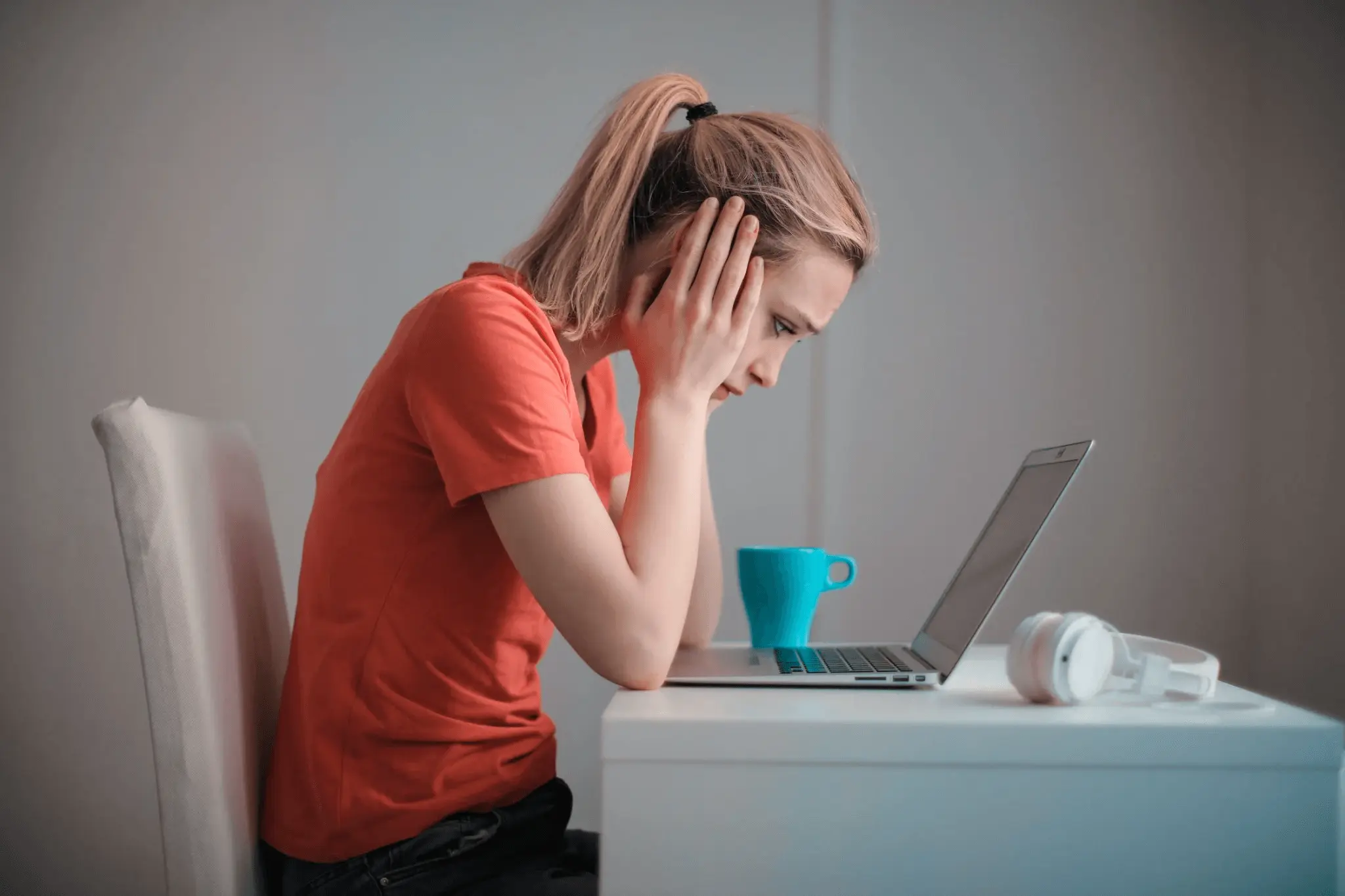  A worried young woman reading about STIs