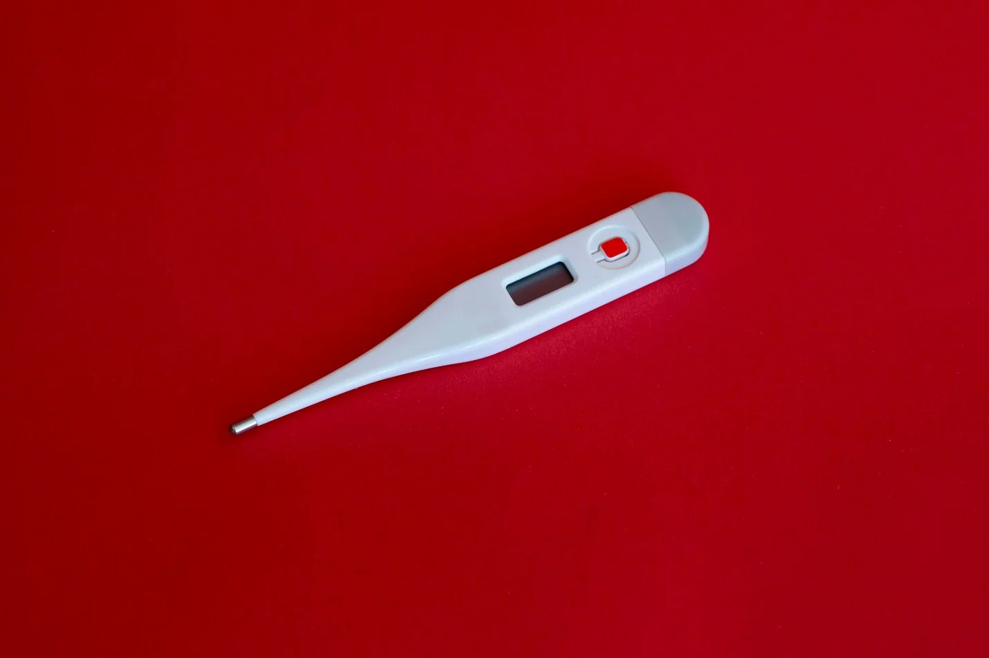 thermometer on a red surface 