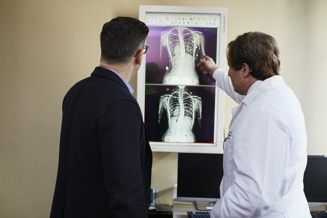 Two doctors looking at x-rays
