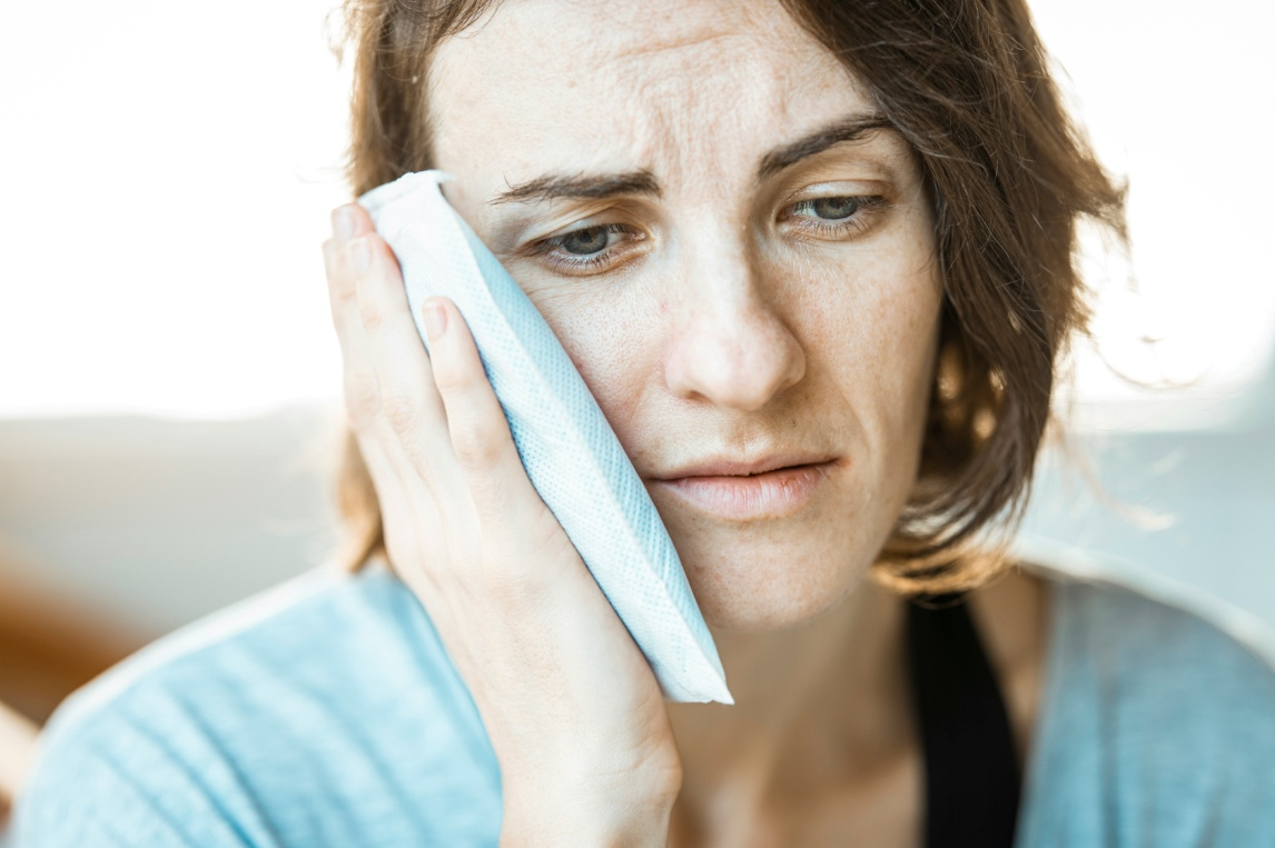 a woman with an ice pack