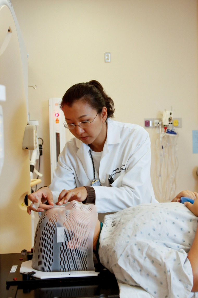 a woman doctor cancer screening a patient