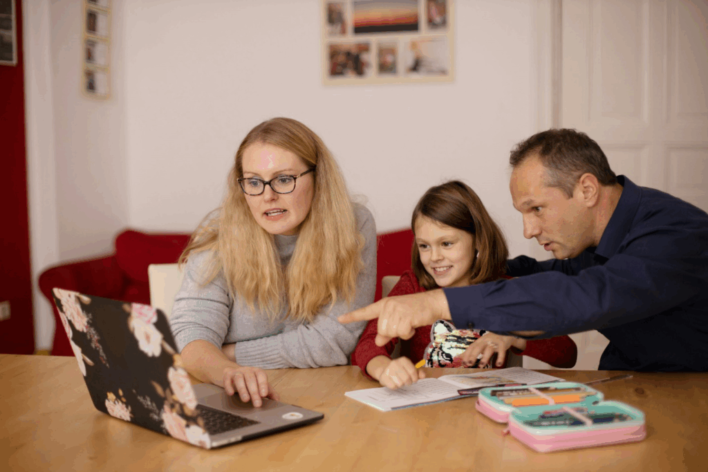 A set of parents helping a child recover from illness.