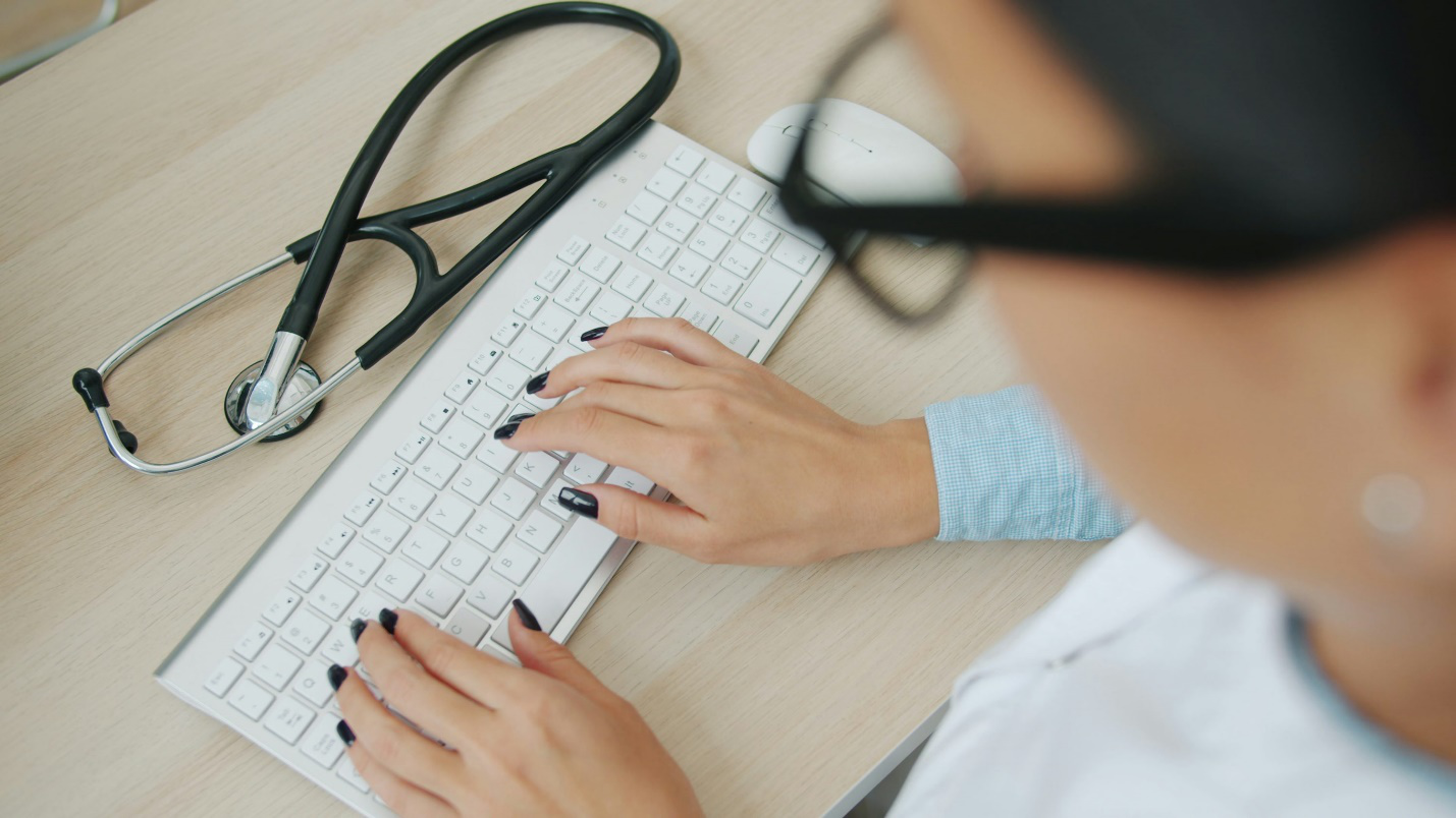 A virtual doctor assisting someone online.