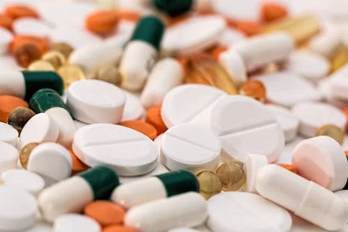 Pills and supplements symbolizing proactive personal health responsibility